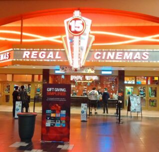 Regal Cinemas movie theatre with people in lobby area