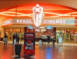 Regal Cinemas movie theatre with people in lobby area